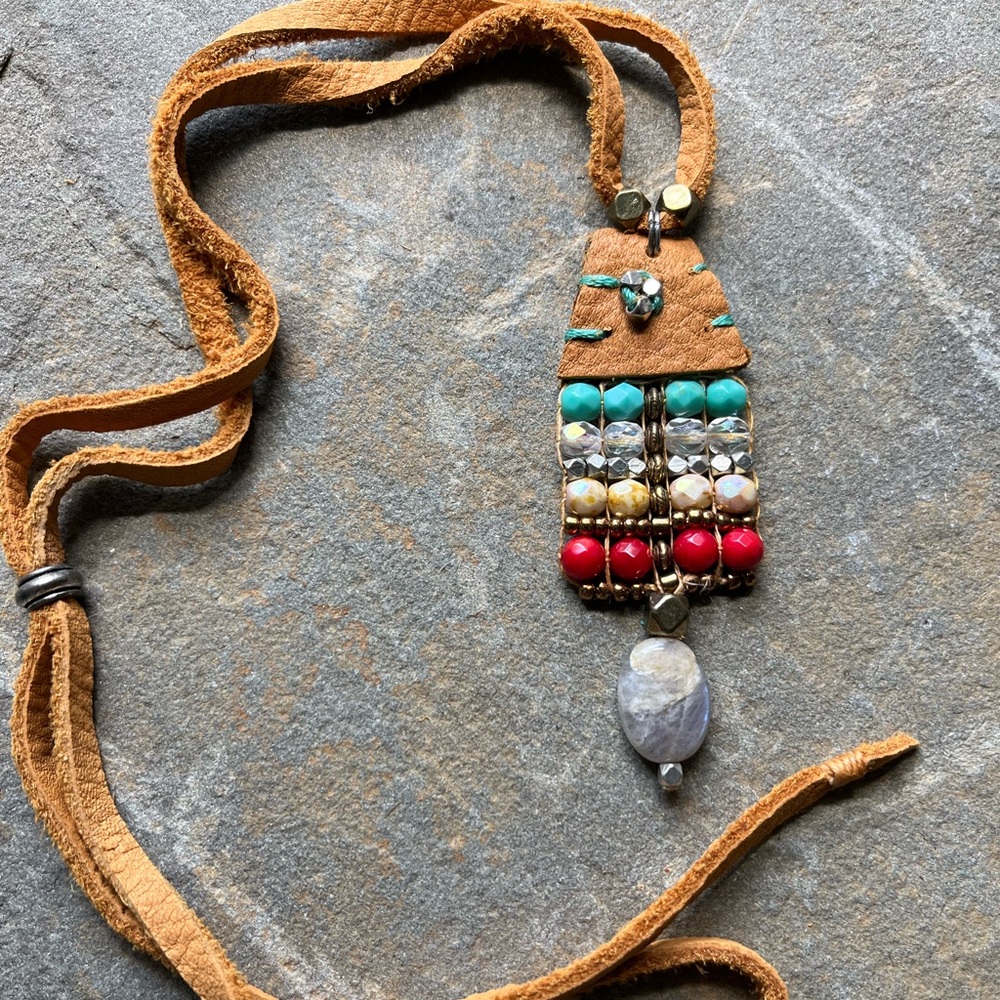 In Sundance style beaded pattern on leather